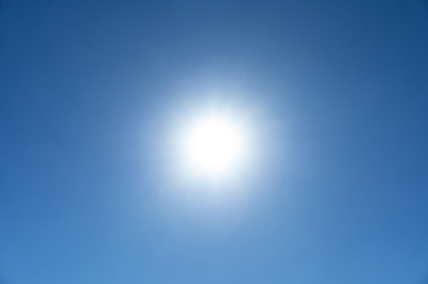 Bright sunburst in blue sky
