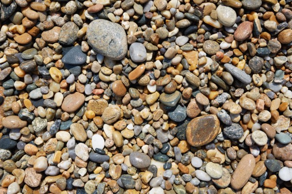 Overhead view of wet stones on beach