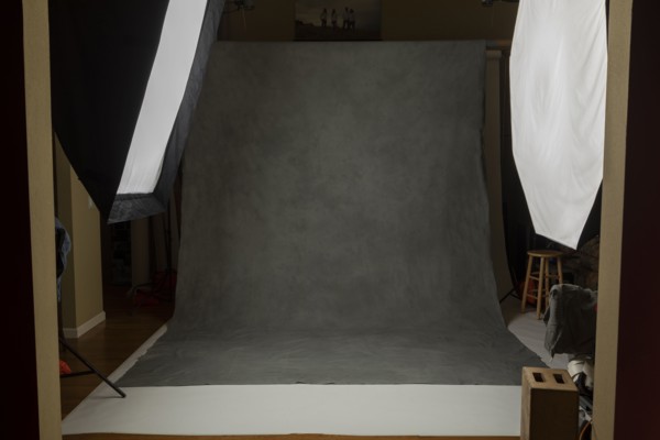 Photo studio set with lightboxes and painted muslin background