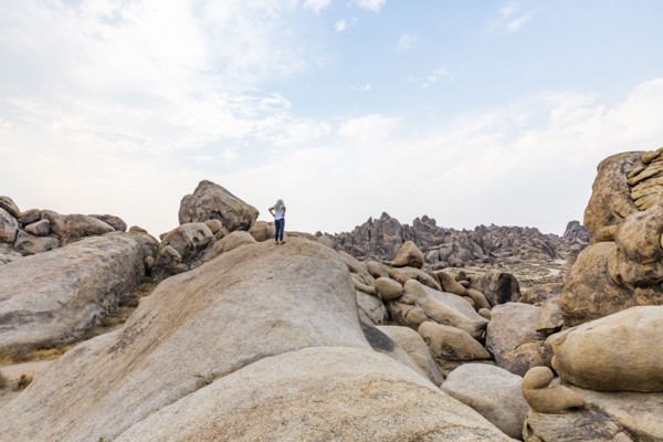Woman looking at Alabama Hills