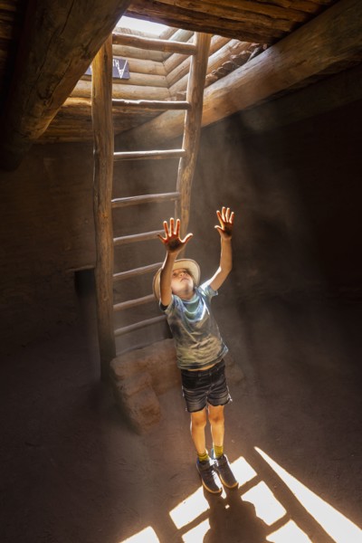 Boy exploring Native American kiva