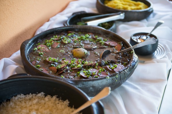 Bowls of traditional beans and rice on buffet table