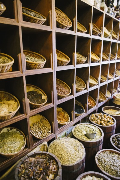 Shelves of sacks of grain for sale in market