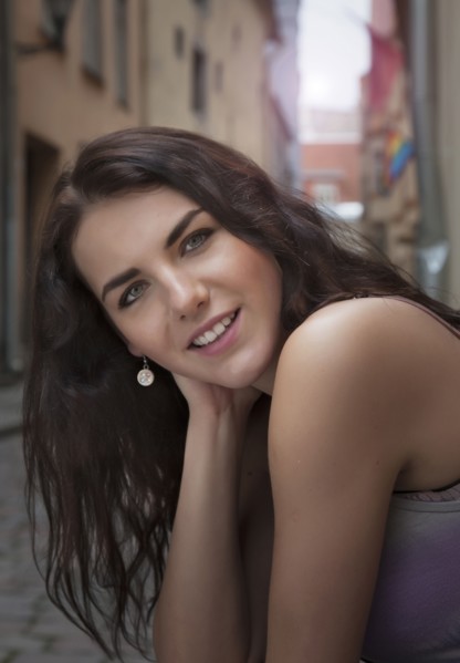 Caucasian woman smiling on city street