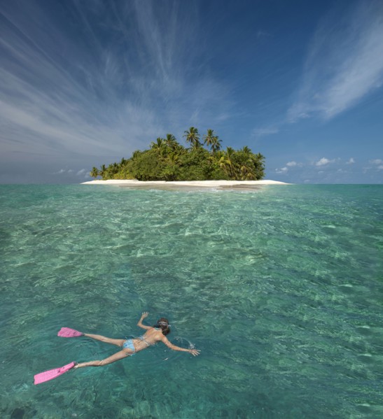 Caucasian woman snorkeling off tropical island