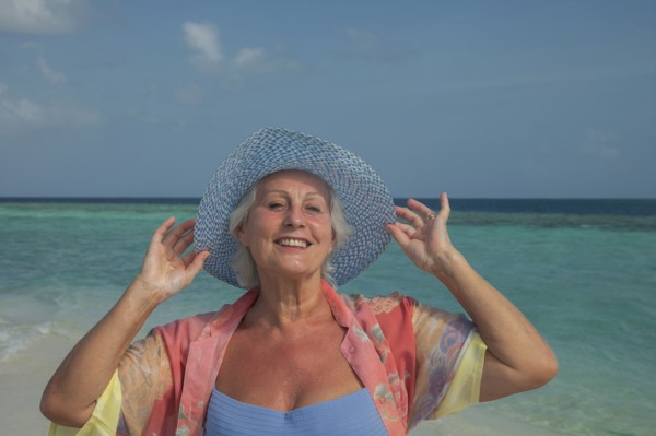 Older Caucasian woman smiling on beach