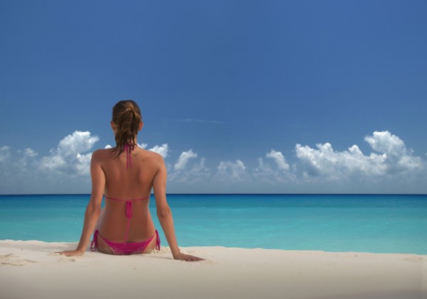 Caucasian woman relaxing on beach