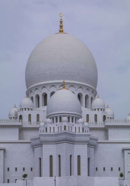 Ornate domed building under cloudy sky