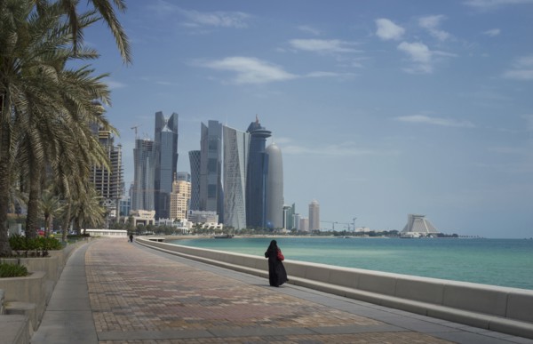 Woman walking on Doha waterfront