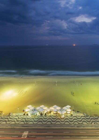 Aerial view of market on beach under cloudy sky