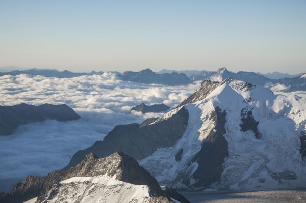 Snowy mountaintops in remote landscape