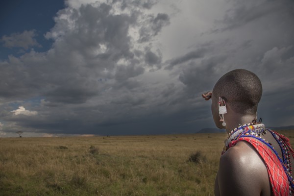 Black man in traditional clothing admiring view