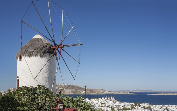 Traditional windmill and Mykonos cityscape