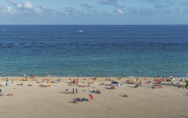Tourists sunbathing on beach