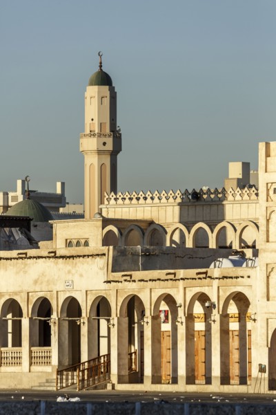 Ornate building and tower under blue sky