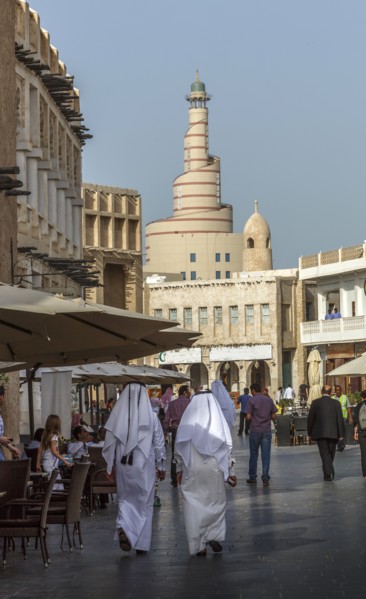 Men walking on Doha street