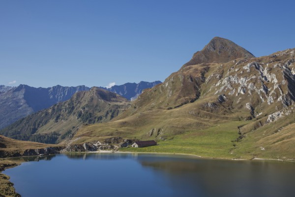 Mountains over still lake in remote landscape