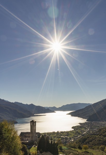 Sun in blue sky over Gravedona