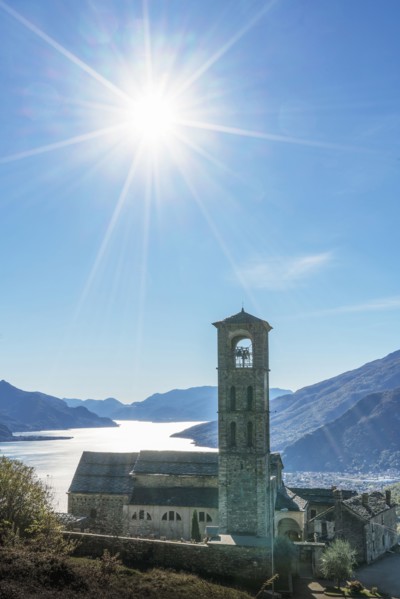 Sun in blue sky over Gravedona