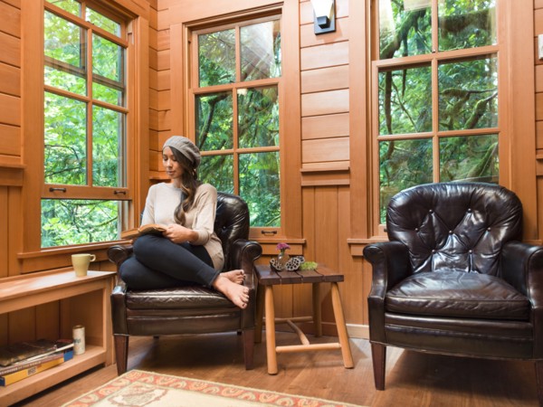 Filipino woman reading in chair