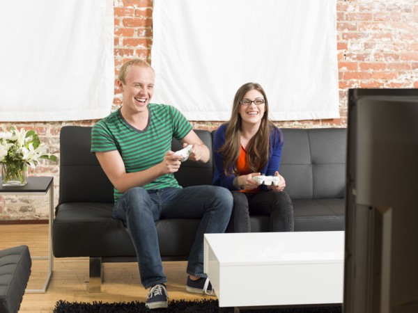 Couple playing video games together