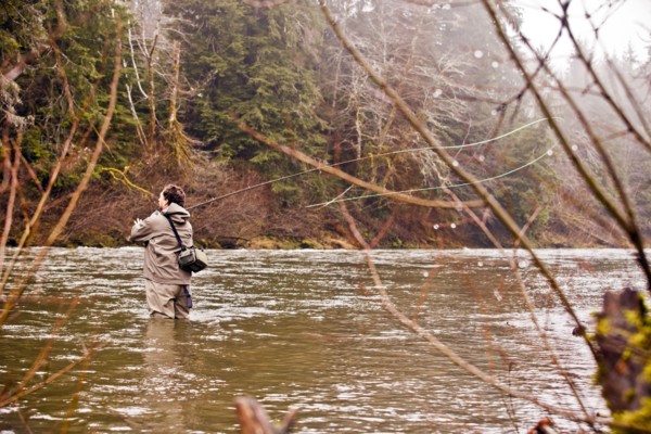 Man fly fishing in rural river