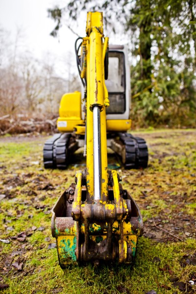 Close up of digger on mossy concrete