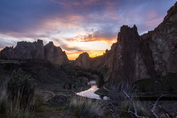 Creek reflecting sunset sky in desert landscape