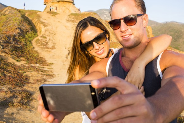 Caucasian couple taking selfie
