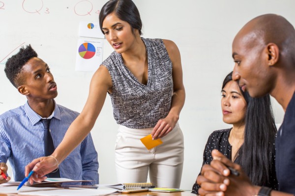 Woman leading business meeting