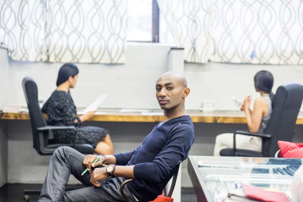 Portrait of serious African American man sitting in office