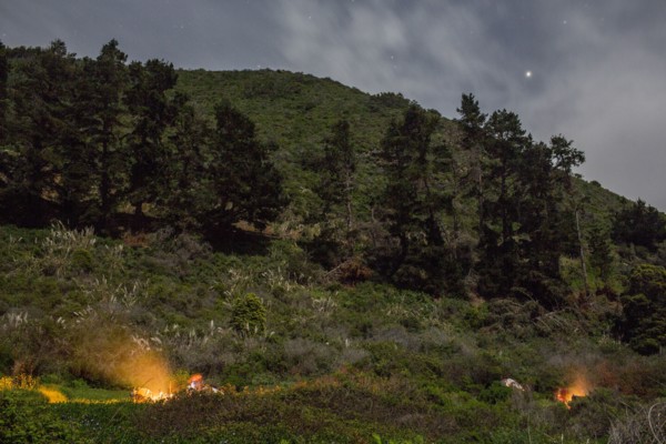 Campfire on hill at night