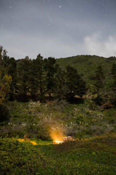 Campfire on hill at night