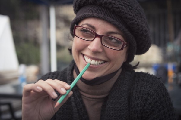 Close up of smiling Caucasian woman holding pencil