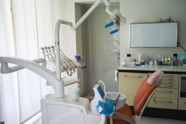 Empty chair in office of dentist