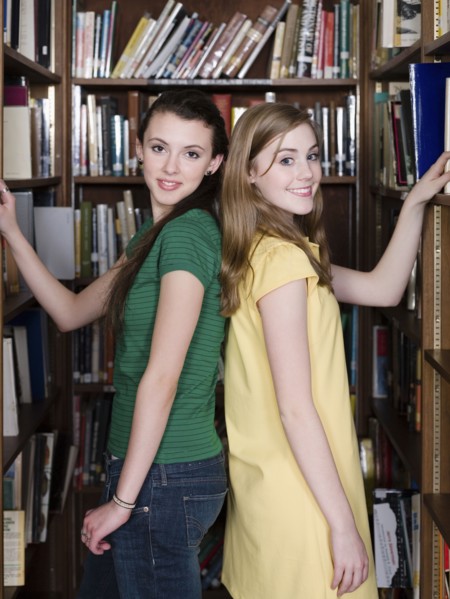 Students choosing books in library
