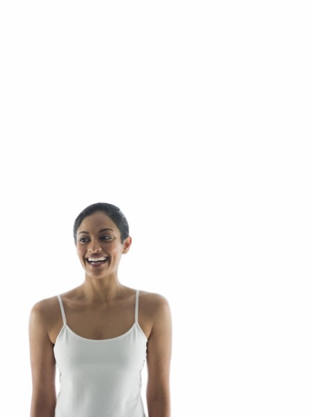 Waist up view of smiling woman standing
