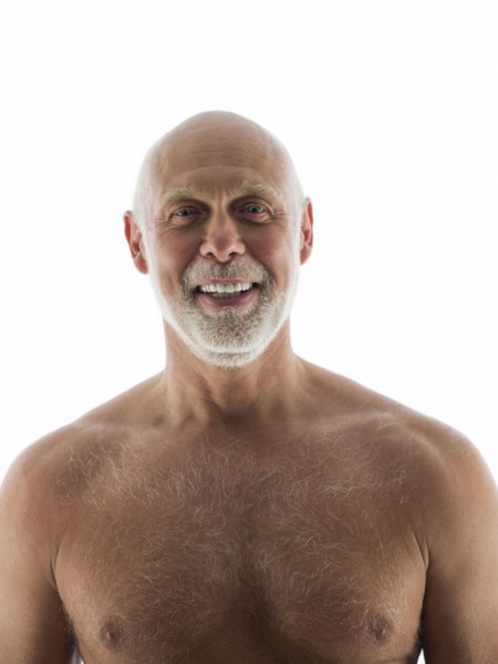 Close up of nude older man smiling