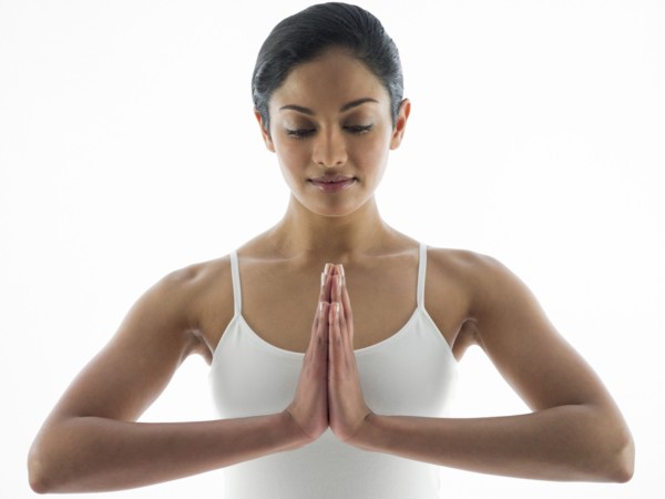 Close up of serene woman meditating