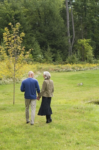 Older couple walking in park