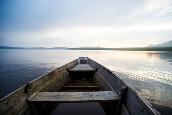 Dilapidated boat on remote lake