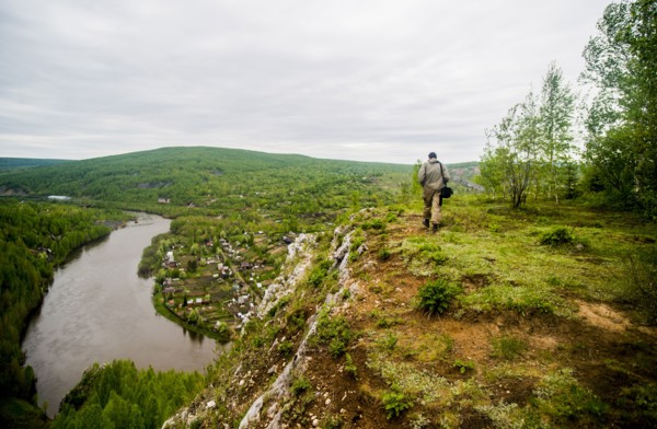 Caucasian man hiking in remote landscape