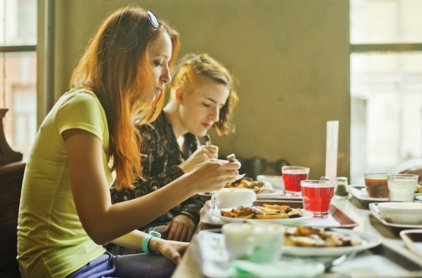 Caucasian women eating in dining room