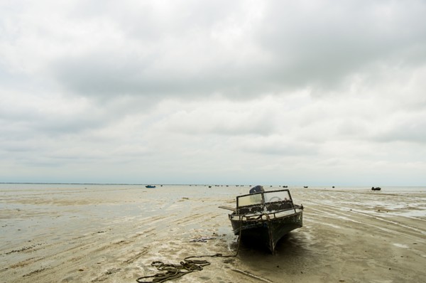 Boat on beach at low tide