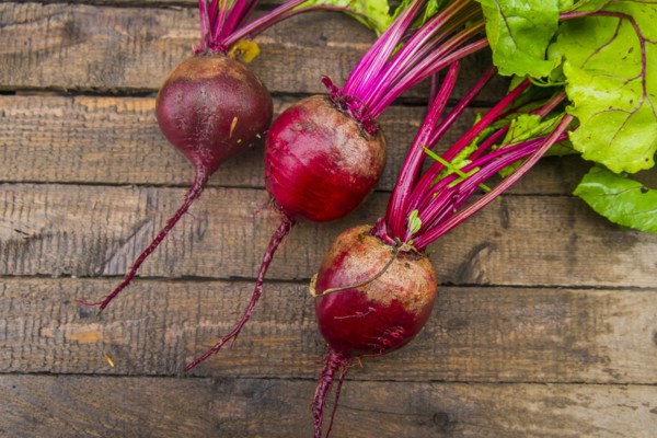 Fresh beets on wooden table