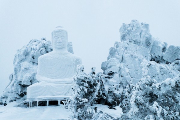 Snow on Buddha statue