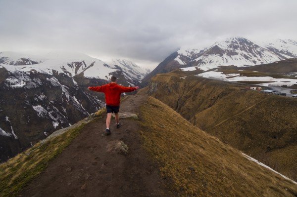 Caucasian man hiking on snowy Mountain