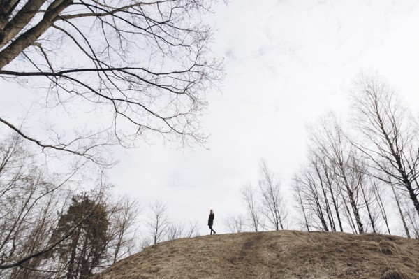 Distant woman standing on hill