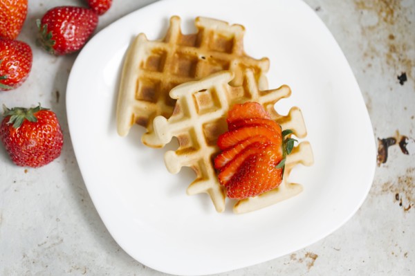 Sliced strawberries on waffles