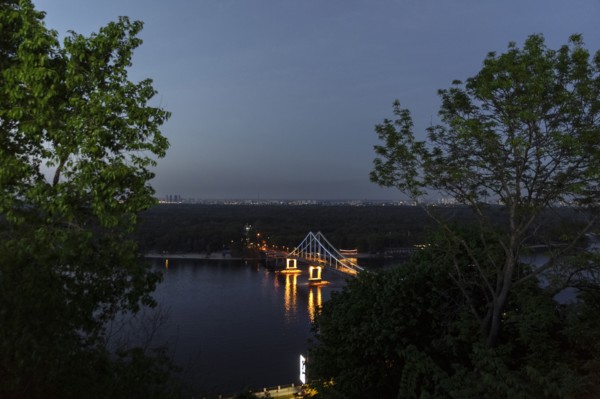 Scenic view of bridge over river at night